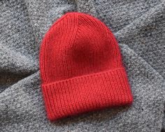 Hand knitted Kid-Silk Wool Classic Ribbed Beanie Hat in Red colour. Size: Adults. Head circumference approx. 58-60 cm (22.8"-23.7") or oversized 56 cm (22"). Height approx. 35 cm (13.7") Material: Wool, Super Kid Mohair and Mulberry Silk. This hat is made of soft and warm yarn. This hat is knitted in a pets free and smoke free studio. Hand wash, max 30oC (86oF). Don't bleach. Don't use fabric softener. Dry Flat. This item is ready to be shipped. I will send you a tracking number when the item is Classic Red Beanie Hat, Red Beanie For Cold Weather, Red Cap For Cold Weather, Fitted Red Knitted Hat, Mohair Hat, Ribbed Hat, Winter Hats Beanie, Wool Beanie, Red Hat