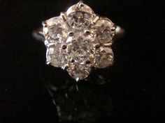 This is a beautiful Edwardian style ring which sits seven very fine natural and tested diamonds, in a cluster fashion, with a total diamond content of 1.5 carats. #crispinjewellery #engagement Diamond Cluster Ring