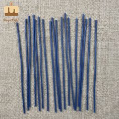 blue plastic straws are lined up on the table