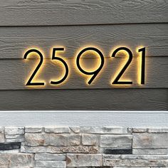 a house number sign on the side of a building