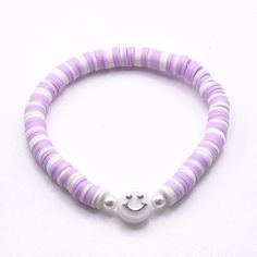 Just keep smiling with this pastel purple and white smiley bracelet. Made with polymer clay beads, these elastic bracelets come in 4 sizes - XS (15cm), S (16.5cm), M (18cm), L (21cm) - each has a further 5cm (approx) stretch for taking on/off. Custom size also available - select personalisation and add note for the size you would like  (extra charge for over 30cm). Refer size guide for more help All items are handmade to order according to the reference photos. Some minor variances may occur eg Clay Bead Bracelet Ideas Purple And Pink, Purple Bracelet Ideas Clay Beads, Purple Clay Bead Bracelet, Polymer Clay Bead Bracelet, Pattern Repetition, Smiley Bracelet, Stacked Beaded Bracelets, Pastel Bracelet, Preppy Bracelets