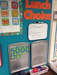 a bulletin board with magnets and numbers on the wall in front of it that says lunch choice