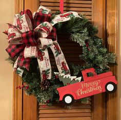 a christmas wreath with a red truck on it