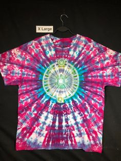 Tie Dyed and screen printed Tee Shirts with authentic ethnic imagery. All of my shirts are One-of a Kind tie dye designs. The screen printed images are drawn from a wide range of traditional ethnic sources, many from Tibetan and Buddhist iconography. Multicolor Bohemian Relaxed Fit T-shirt, Bohemian Pink Graphic Print T-shirt, Bohemian Multicolor Print Short Sleeve T-shirt, Bohemian Cotton Shirt For Festivals, Bohemian Multicolor Graphic Print T-shirt, Traditional Printed Shirt For Festivals, Bohemian Cotton Shirt With Batik Print, Bohemian Multicolor Relaxed Fit T-shirt, Bohemian Style Multicolor Relaxed Fit T-shirt