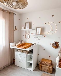 a white bathroom with lots of hearts on the wall and shelves above it, along with other items