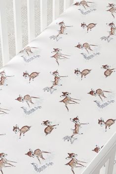 a crib sheet with deers on it