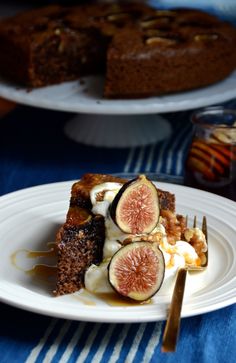 there is a piece of cake with figs on it and ice cream in the middle