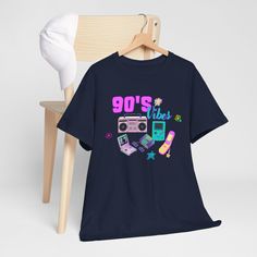 This 90's Vibes Graphic Tee exudes an old school vibe, perfect for those looking to make a statement. The classic fit and comfortable fabric make it ideal for everyday wear, while the unique graphic adds a touch of personality. This tee is great for adults looking to showcase their love for the 90's, and is perfect for casual outings, parties, or as a gift for fashion-forward individuals. Product features - Shoulder tape for stability and prevention of stretching - Ribbed knit collar for elastic 90's Vibes, 90s Vibes, Knit Collar, Heavy Cotton, Cotton Tee, Product Features, Graphic Tee, Ribbed Knit, Fashion Forward