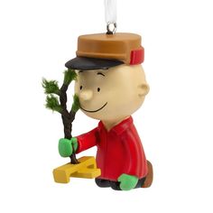 a small plastic ornament with a man holding a tree in it's hand