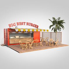 a big best burger stand with tables and chairs on the deck next to a palm tree