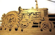 a wooden cutout of a tractor is shown