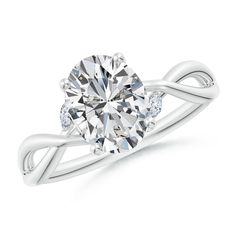 a white gold ring with an oval cut diamond in the center and two diamonds on each side