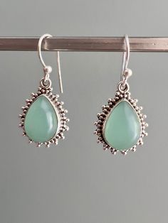 Sterling silver oval aqua chalcedony earrings Matching necklace available Gift box available for purchase. Search GIFTBOX Chalcedony Drop Earrings As Gift, Drop Chalcedony Earrings As A Gift, Silver Jade Earrings As Gift, Silver Jade Earrings For Gift, Oval Gemstone Teardrop Earrings As Gift, Elegant Nickel-free Chalcedony Jewelry, Elegant Chalcedony Drop Earrings, Handmade Chalcedony Earrings For Gifts, Handmade Chalcedony Earrings As Gift