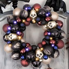 a wreath with skulls and lights on it