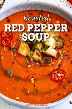 roasted red pepper soup in a bowl with bread and tomatoes on the side text reads roasted red pepper soup