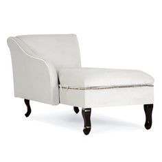 an upholstered chaise lounge chair with nail polishing on the armrests