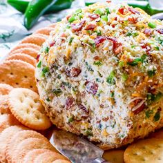 a cheese ball with crackers on the side