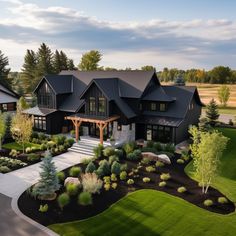 an aerial view of a house with landscaping