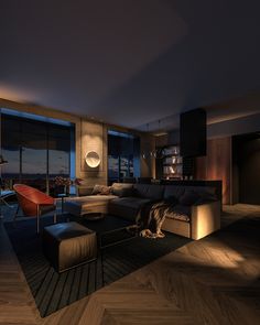 a living room filled with furniture and a large window overlooking the city at night time