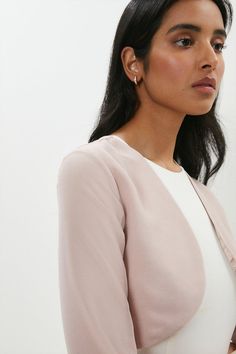 Achieve instant cover girl status with this elegant cropped bolero. Sumptuously smooth to the touch, it features curved, collar-free lapels and long bracelet sleeves for a sleek, fuss-free finish.Style: JacketDesign: PlainFabric: PolyesterLength: CroppedNeckline: CollarlessSleeve Length: Long Sleeve Long Bracelet, Girls Status, Cover Girl, How To Find Out, Sleek, Bracelet, Collar, Long Sleeve, Pink