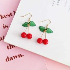 Cheerio! Finely detailed, gold-plated Cherry Earrings with tiny glass leaves are a compliment waiting to happen. They can be worn with daily fashion, a t-shirt, or they are sophisticated and detailed enough to wear with a formal dress. Elegant Cherry Colored Jewelry For Party, Elegant Cherry Drop Earrings, Cherry Colored Earrings For Summer Party, Cherry Color Earrings For Summer Party, Nickel-free Casual Party Earrings, Casual Nickel-free Earrings For Party, Casual Gold Earrings For Party, Casual Gold Drop Earrings, Book Clock