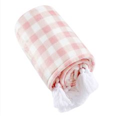 a pink and white checkered blanket with tassels on the bottom, rolled up