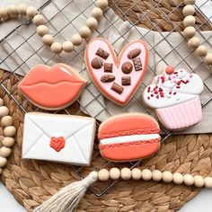 decorated cookies and pastries on a wicker tray