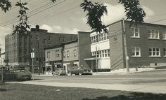 an old black and white photo of some buildings