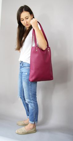 "Leather tote bag, Leather tote, Tote bag leather, Tote bag, Leather tote woman, Leather tote - MADRID SIMPLE LEATHER TOTE BAG Dimensions: Height: 15.5'' 39 cm Width: 12.2'' 31 cm Handles: 23.6'' 60 cm Handle drop: 10.2\" 26 cm Casual and simple tote bag made from high quality pebbled leather. It is slim, lightweight, strong and fits comfortably over the shoulder. * Highest quality Italian leather * Includes interior zipped pocket and key chain * Gold zipper & hardware * Fits a laptop (up to Daily Tote Satchel With Handles, Burgundy Shoulder Bag For Everyday Use, Everyday Rectangular Burgundy Bag, Everyday Burgundy Shoulder Bag, Leather Handle Daily Tote Shoulder Bag, Burgundy Tote Bag For Shopping, Burgundy Shoulder Bag For Everyday, Burgundy Everyday Shoulder Bag, Everyday Bucket Tote Bag