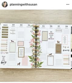 an open planner book sitting on top of a wooden table