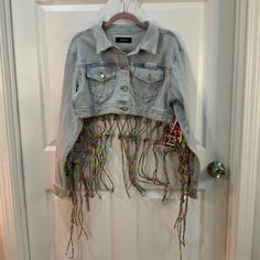 Akira Metallic Rhinestone Multi Color Cropped Jean Jacket Size Xs/S Multi Colored Rhinestones Knotted Ribbons Hang Long In Back Long Sleeve Cropped Denim Jacket Light Wash Pink Blue Yellow Green Purple New With Tags Rhinestones Cover Back One Rhinestone Ribbon Is Off In The Back See Picture Pit To Pit 20” Length 15” Awesome Jacket Be One Of A Kind Spring Party Outerwear With Rhinestone Fringe, Trendy Spring Denim Jacket With Rhinestone Fringe, Fitted Long Sleeve Outerwear With Rhinestone Fringe, Trendy Embellished Blue Outerwear, Trendy Blue Embellished Outerwear, Casual Long Sleeve Outerwear With Rhinestone Fringe, Fur Jean Jacket, Summer Dress Trends, Jean Jacket Patches