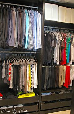 a closet filled with lots of different colored shirts