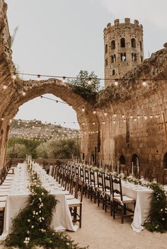 an outdoor wedding venue with tables and chairs set up for the guests to sit down