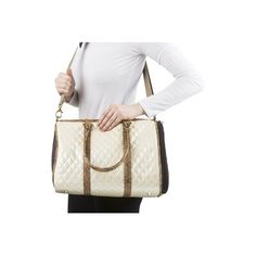 a woman holding a white purse with gold trimmings on the handles and sides