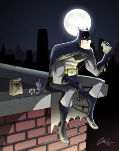 a batman sitting on top of a brick wall under a moon filled sky with buildings in the background