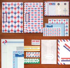 various mail envelopes and labels on a wooden table with red, white, and blue designs