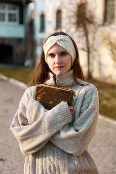 Warm white cosy merino headband, hand knitted minimal style ear warmer, natural soft wool winter band, gift idea for a chilly fiancée The white merino headband from the Majestic Feel series is in an autumn shade of warm white. It is a delicate and soft head accessory that will pleasantly protect you from cold and wind, and will also present itself in a really elegant way. You will be warm in this light band, and you will not even feel it. It can be worn from autumn to spring, because it is warm Cable Headband, Knit Alpaca, Wool Winter, Ear Warmer, Minimal Style, Head Accessories, Style Expert, Soft Wool, Ear Warmers