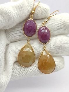 We use fine quality cut and polished gemstone, all gemstone are eye clean. We make sure each stone is same in cut, quality, colour & shape  so that our customer could get the finest product. 925 sterling silver sapphire dangle drop earring. gold plated Item Description Pink , Yellow Sapphire earring Gross WT - 13.51 gram Silver wt - 3 gram Stone wt - 52.55 ct Polish - gold Stone size - free size Shipping Policy : : Ready to ship in - 5 to 7 business days : All items will be carefully packed and shipped through UPS , Aramax , India post international and other Courier Services , with Online Tracking number : Net Delivery Time - within 10 to 20 DAYS Custom and Import Taxes : Buyers are responsible for any custom and import taxes that may apply in their country. Returns and Exchanges : : I gl Fine Jewelry With Natural Teardrop Gemstones, Pink Gemstone Earrings For Gift, Elegant Gemstone Round-cut Earrings, Classic Pink Gemstone Earrings, Elegant Faceted Sapphire Gemstones, Pink Multi-stone Earrings For Gift, Sapphire Earring, Pink Multi-stone Round Earrings, Women Jewellery