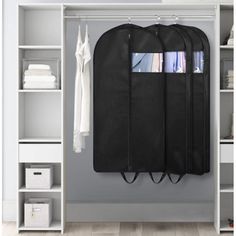 an open closet with clothes hanging on it