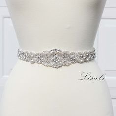 LISALI Sparkly Wedding Belt, Bling Belts, Rhinestone Belt, Wedding Belts, Bridal Belts, Rhinestone Chain Belt, Crystal Sash Belt 💗Made of  - This beautiful sash is made with pearls, sparkly rhinestones details, very elegant.  - The rhinestone portion is about 2" wide at the widest point, other 1" wide and the length is variable.  - The ribbon in the main picture is bridal white.( ribbon can be any color you would like) 💗Finsh/Ribbon color - Satin / Oraganza ribbon  your color choice - 108" lon White Crystal Wedding Sash, Wedding Dress Belts, Sparkly Belts, Belt Wedding Dress, Wedding Garter Blue, Jeweled Belts, Bridal Belts, Bling Belts, Dress Belts