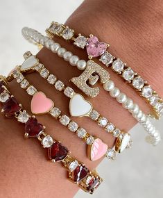 Girl things but make it luxe. Meet our decadent tennis bracelet that features a substantial, connected-hearts design and is adjustable with its extender clasp chain. Made of 14 Gold-plated over brass and hypoallergenic, this holiday season & beyond everyone will be envious of your arm candies. Perfect for stacking! Measures at 6.5 inches with additional extension. Pink Heart Bracelet, Heart Tennis Bracelet, Arm Candies, Connected Hearts, Clear Heart, Hearts Design, Heart To Heart, Best Jewelry, Girl Things