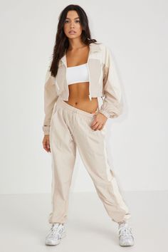 We're playing for keeps in these trackies! Features - Elastic waist with adjustable drawstring - Cuffed ankles - 2-pocket detailing Size & Fit - Fit: Relaxed - Rise: High - Model is wearing size S Materials & Care - Content: 100% nylon - Care: Machine wash, cold - Imported Cropped Windbreaker, Playing For Keeps, For Keeps, Pebble Grey, Track Pant, Bottom Clothes, Windbreaker Jacket, Bottoms Pants, Track Pants