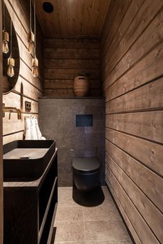 a bathroom with wooden walls and flooring