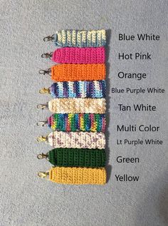 several colors of crochet bracelets are arranged on the floor with text that says blue white hot pink orange blue purple tan multi color