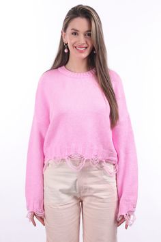 Made from 100% cotton, the "Ripped Crop Sweater" is a trendy clothing item that combines the comfort of a sweater with a trendy, distressed look. This distressed look is a popular style in fashion.Featuring long sleeves and a scoop neck, the "Ripped Crop Sweater" is a fashionable and versatile addition to one's wardrobe. High-waisted jeans can be paired with a variety of bottoms, such as shorts, skirts or layered dresses. The ripped details give it a slightly edgy and casual look; This makes it Trendy Distressed Sweater For Winter, Distressed Crew Neck Sweater For Winter, Distressed Cotton Long Sleeve Sweater, Distressed Long Sleeve Cotton Sweater, Trendy Distressed Winter Sweater, Distressed Long Sleeve Winter Sweater, Distressed Sweater For Fall Layering, Winter Distressed Crew Neck Sweater, Long Sleeve Sweater With Frayed Hem For Fall