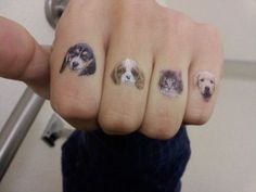 a person with four dogs on their fingers