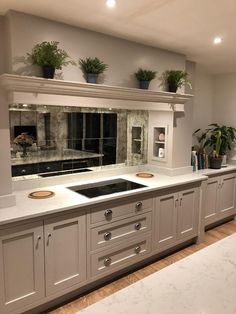 a kitchen with an oven, sink and counter tops in it's center island