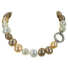 Stunning Lustrous White, Gold and Bronze semi-round Faux Pearl Statement Necklace; Each Luscious Pearl measuring approx 18.5mm x 16mm; hand knotted with matching color silk thread; held by a round CZ encrusted clasp; approx 18.5” long. Chic and Timeless strand of Pearls, taking you effortlessly from day to evening! Fake Pearl Necklace, Necklaces Choker, Vintage Choker Necklace, Diamond Choker Necklace, Pearl Statement Necklace, Long Statement Necklace, Vintage Choker, Bronze Necklace, White Pearl Necklace