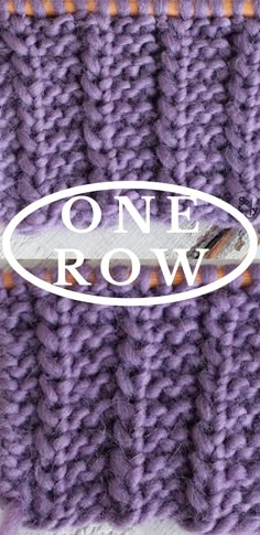 a purple knitted object with the words one row on it and an oval sticker