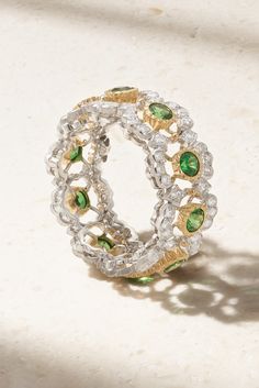 Buccellati's exquisite pieces are handcrafted in Italy by skilled artisans using centuries-old techniques. This 'Ghirlanda Eternelle' ring is crafted from 18-karat white gold in a crochet-inspired design and set with sparkling diamonds. The tsavorites are mounted in 18-karat yellow gold settings to showcase their vibrancy. Luxury Tsavorite Emerald Ring For Formal Occasions, Luxury Emerald Ring For May Birthstone, Luxury Tsavorite Emerald Ring, Luxury White Gold Emerald Ring With Rose Cut Diamonds, Luxury Oval Tsavorite Jewelry, Luxury Tsavorite Emerald Anniversary Ring, Luxury Tsavorite Emerald Ring For Anniversary, Luxury Multi-stone Emerald Ring For May Birthstone, Luxury Tsavorite Rings For Anniversary